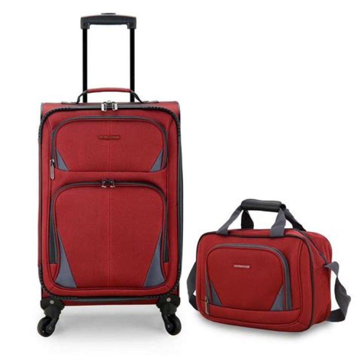 A red rolling suitcase