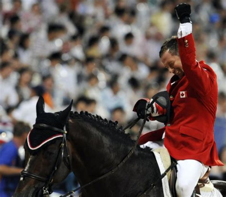 Eric Lamaze, riding Hickstead, celebrates after winning gold in the 2008 Olympic Games.