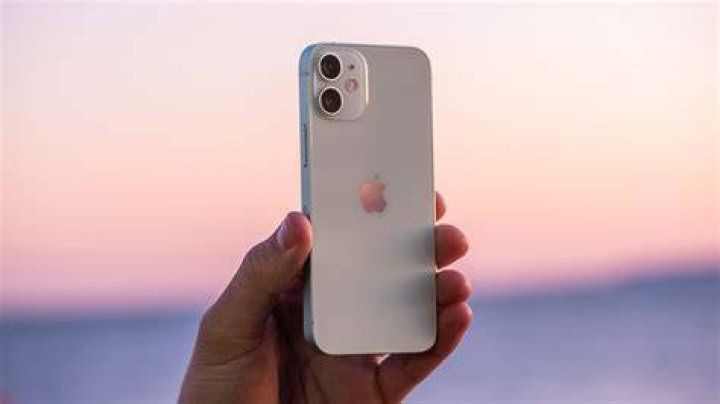 iPhone 12 Mini back held up with hand 1 iPhone 12 Mini back held up with hand 1