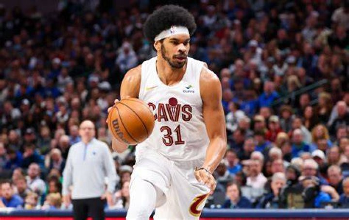 Jarrett Allen with fireworks behind him