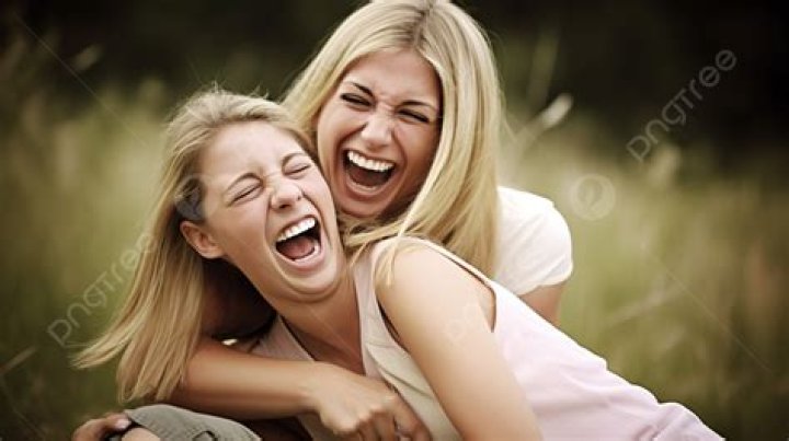 Two women captured while laughing